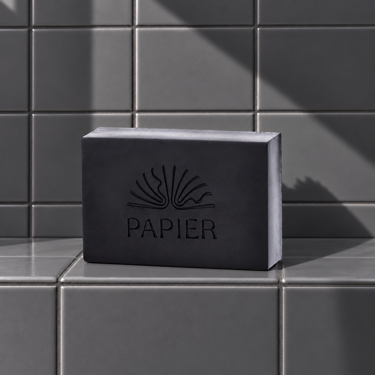 Black rectangle bar soap laser engraved with a brand logo, 3.25 oz