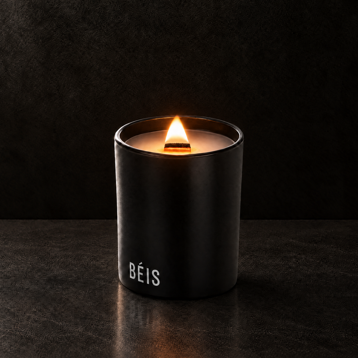 Matte Black 14 oz. Luxury Printed Candle lit with a printed custom logo, shown on a matching black background.