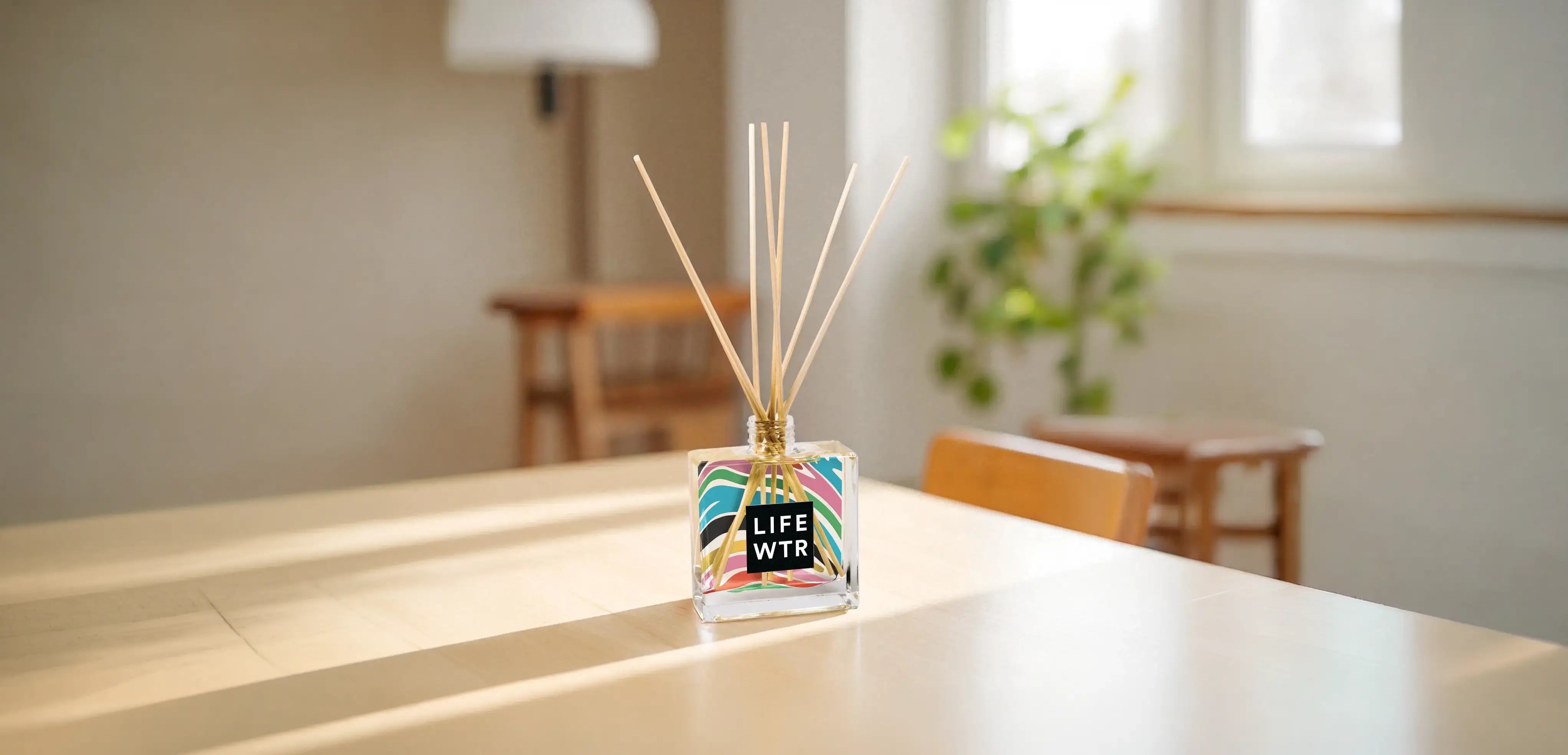 Clear Reed Diffuser lifestyle image on a soft warm background