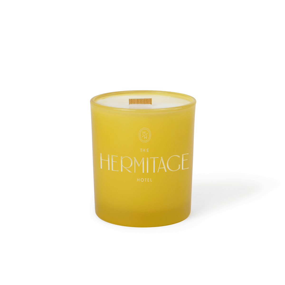 Printed-logo yellow colored glass candle in 14 oz size, photographed on its own