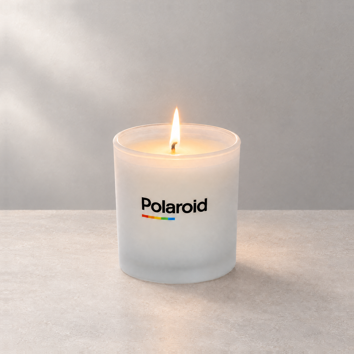Satin Frosted 9 oz. Classic Printed Candle lit with a printed custom logo, shown on a matching frosted background.