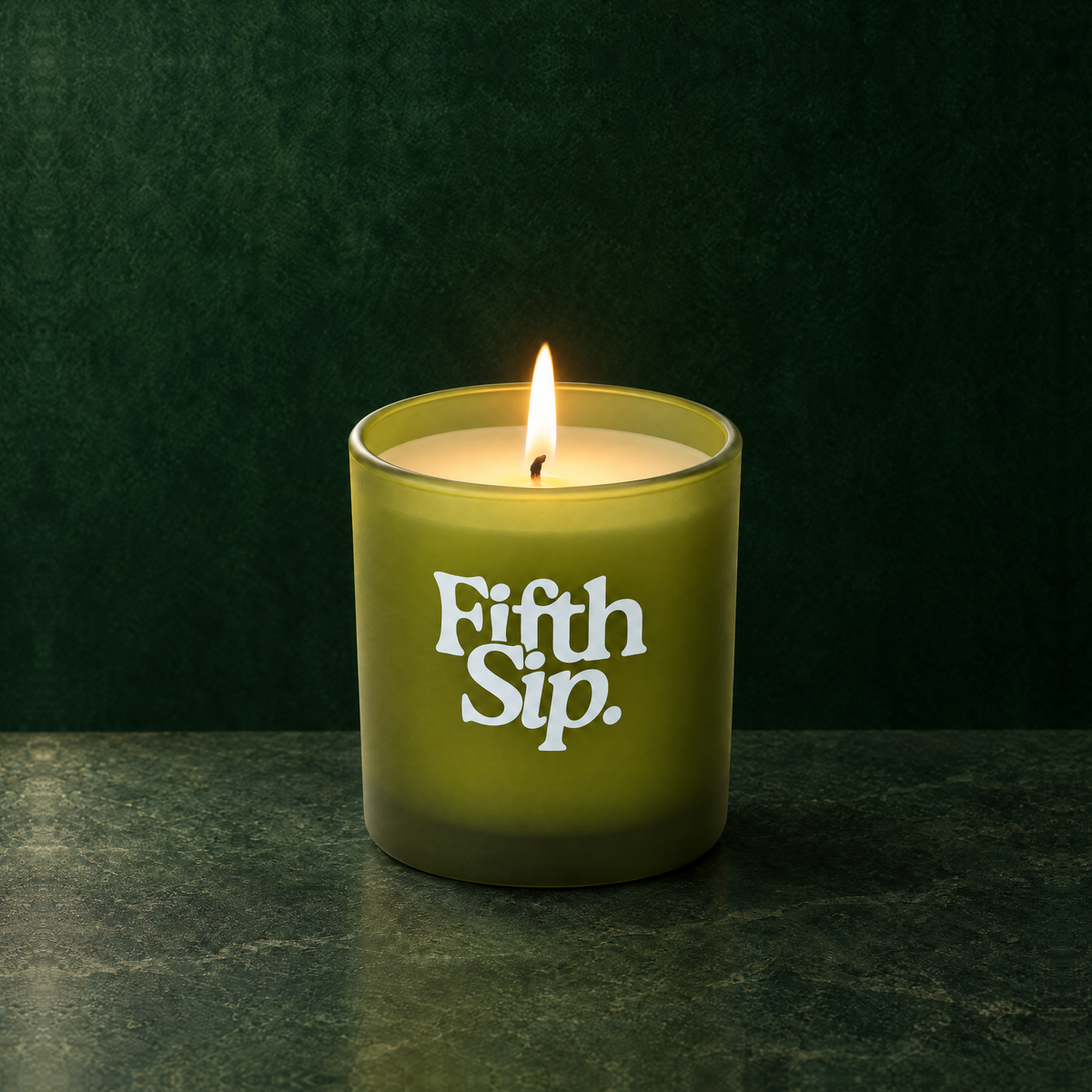Green 9 oz. Classic Printed Candle lit with a printed custom logo, shown on a matching green background.