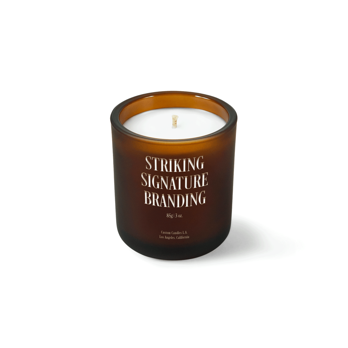 Amber frosted 3 oz Mini Signature candle with a laser-engraved custom logo, shown on its own.