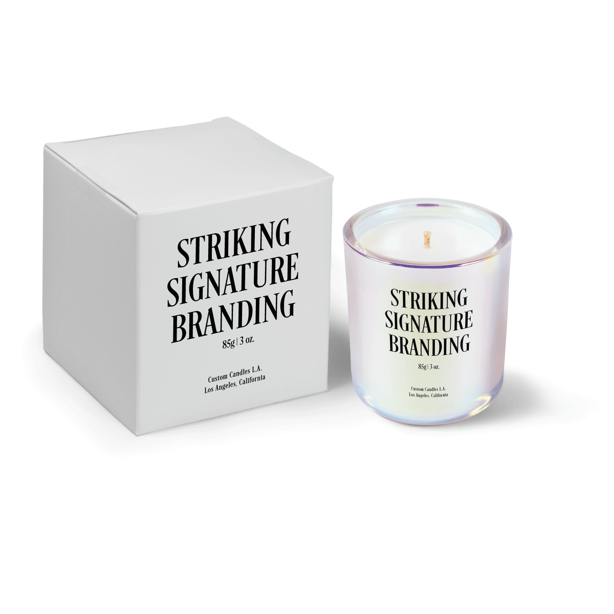 Iridescent pink 3 oz Mini Signature candle, printed, shown beside its gift box.