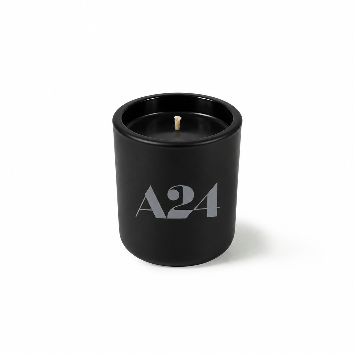 Jet black 3 oz Mini Signature candle poured with black wax, shown on its own.