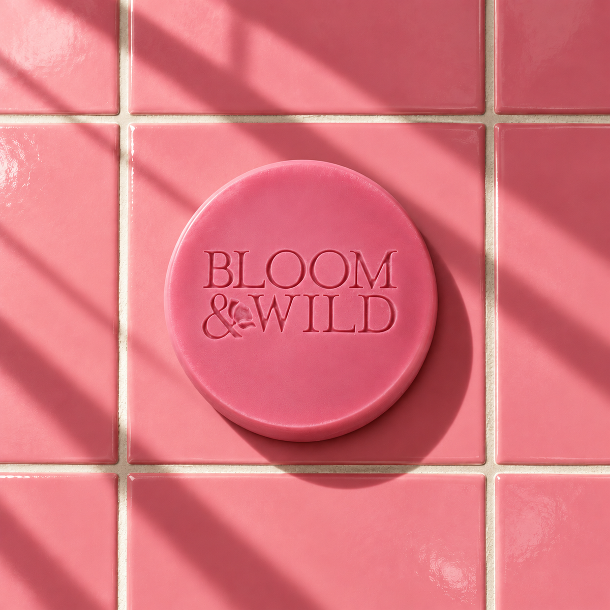 Pink round bar soap laser engraved with a brand logo, 3.6 oz