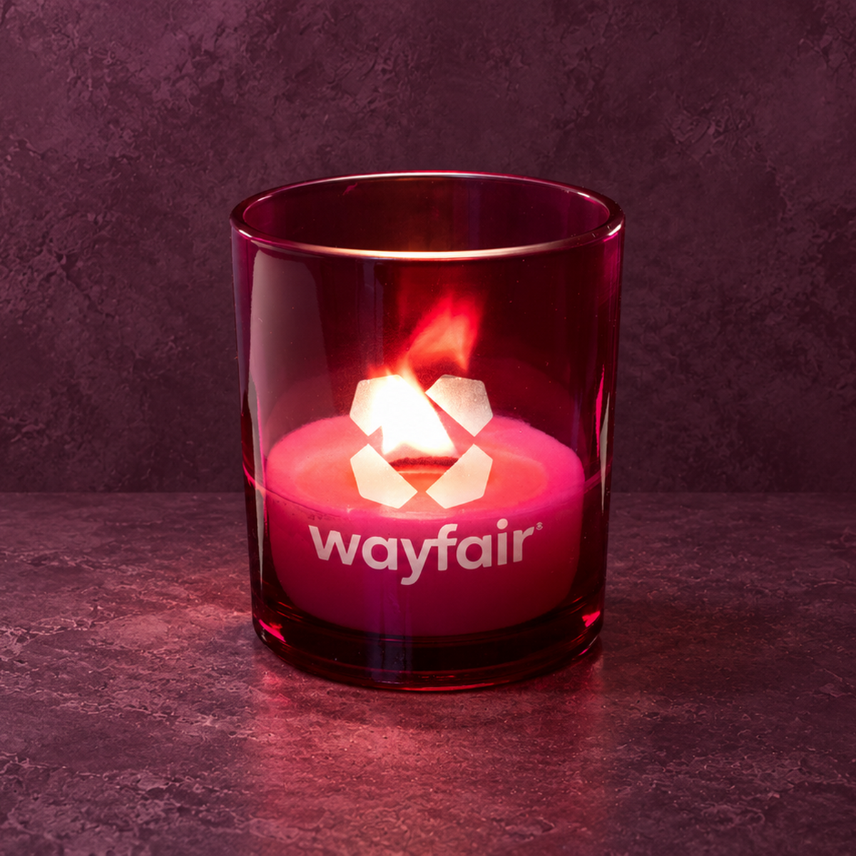 Purple 14 oz. Luxury Engraved Candle with a custom engraved logo, lit.
