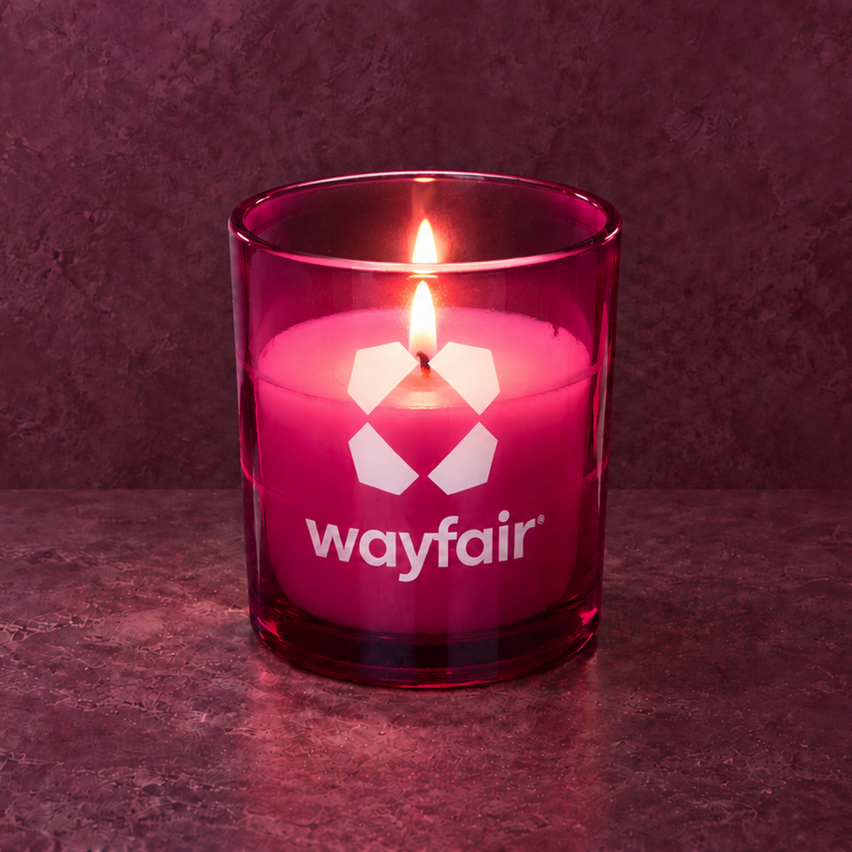 Purple 9 oz. Classic Engraved Candle with a custom engraved logo, lit.