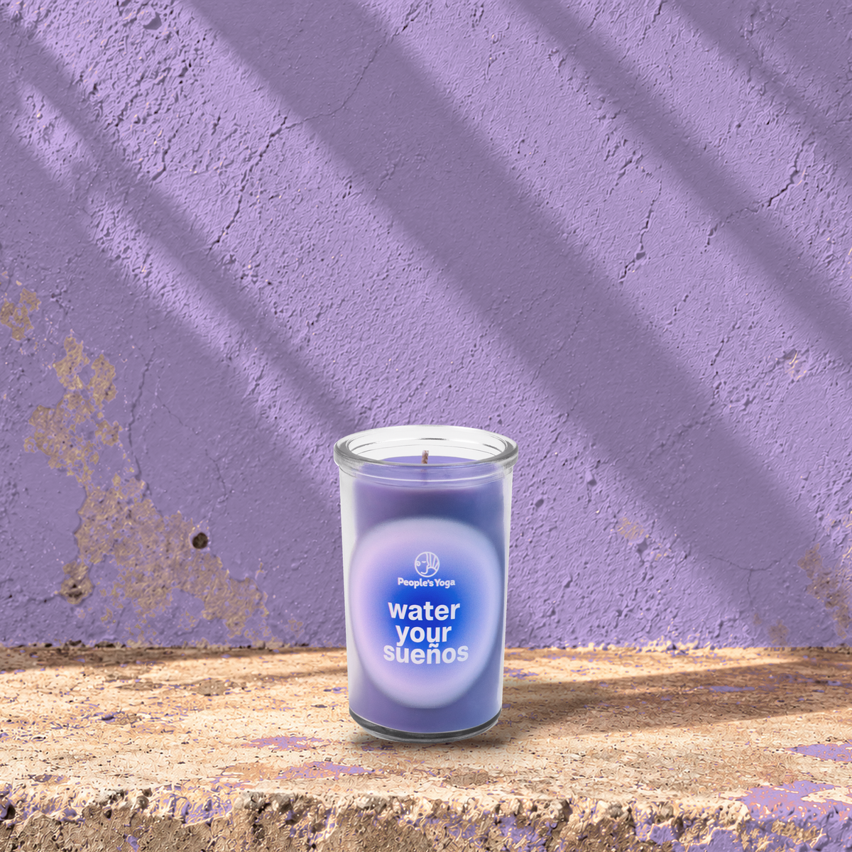 Purple 5 oz custom mini prayer candle printed with the People's Yoga logo on a purple background, unlit