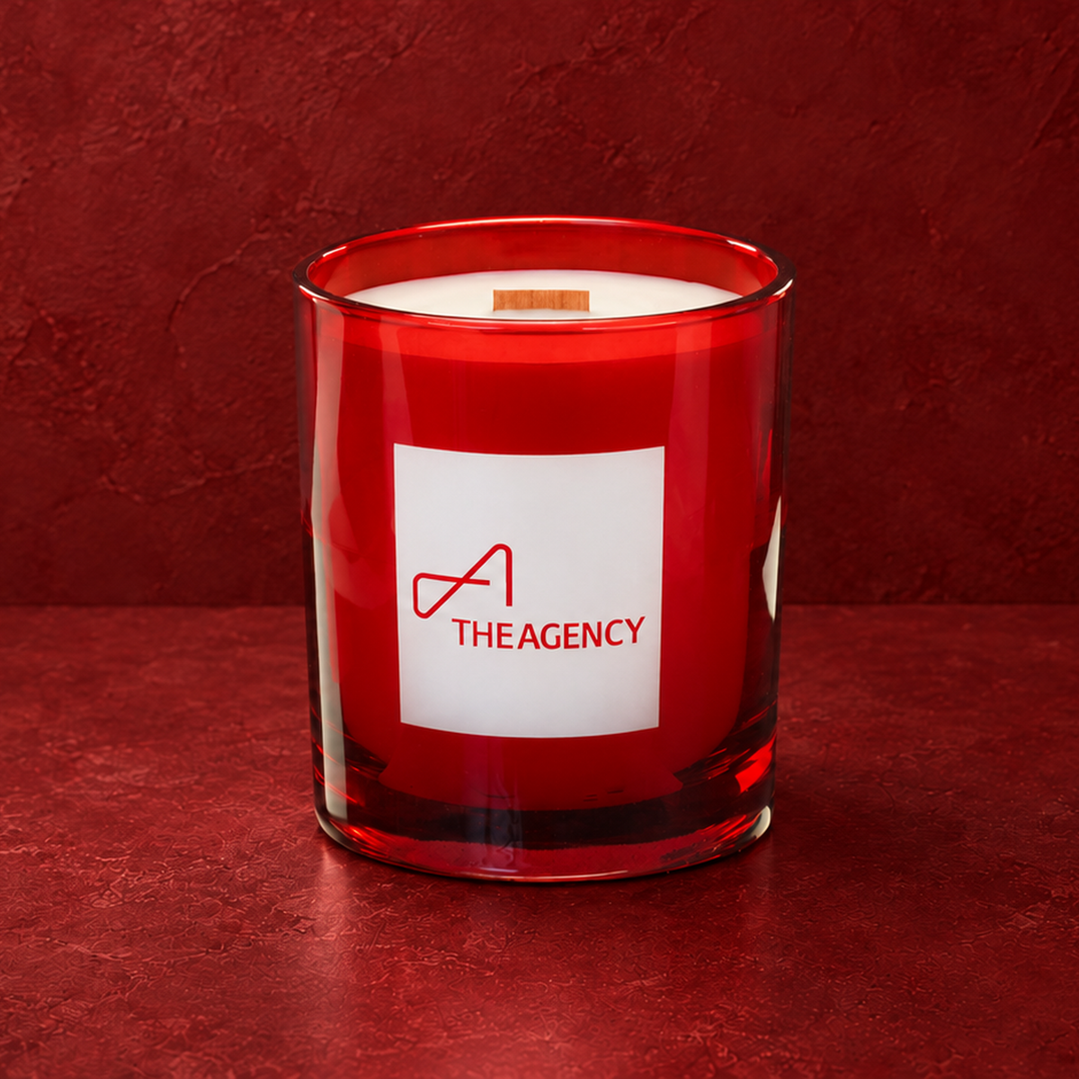 Red 14 oz. Luxury Engraved Candle with a custom engraved logo, unlit.
