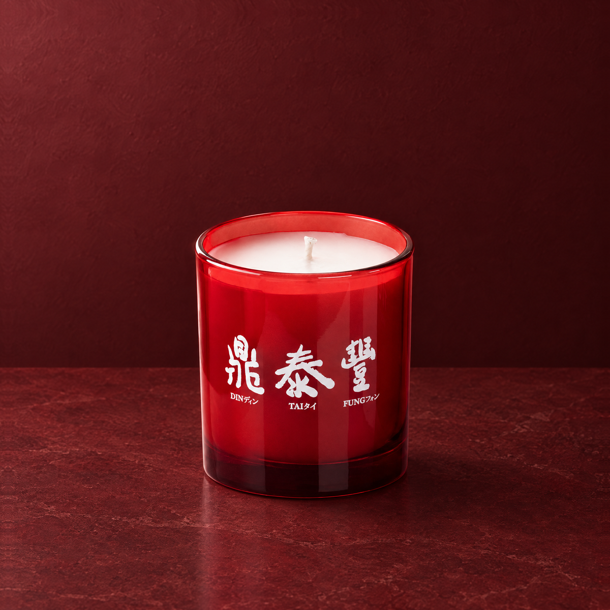 Red 9 oz. Classic Printed Candle with a custom printed logo, unlit.