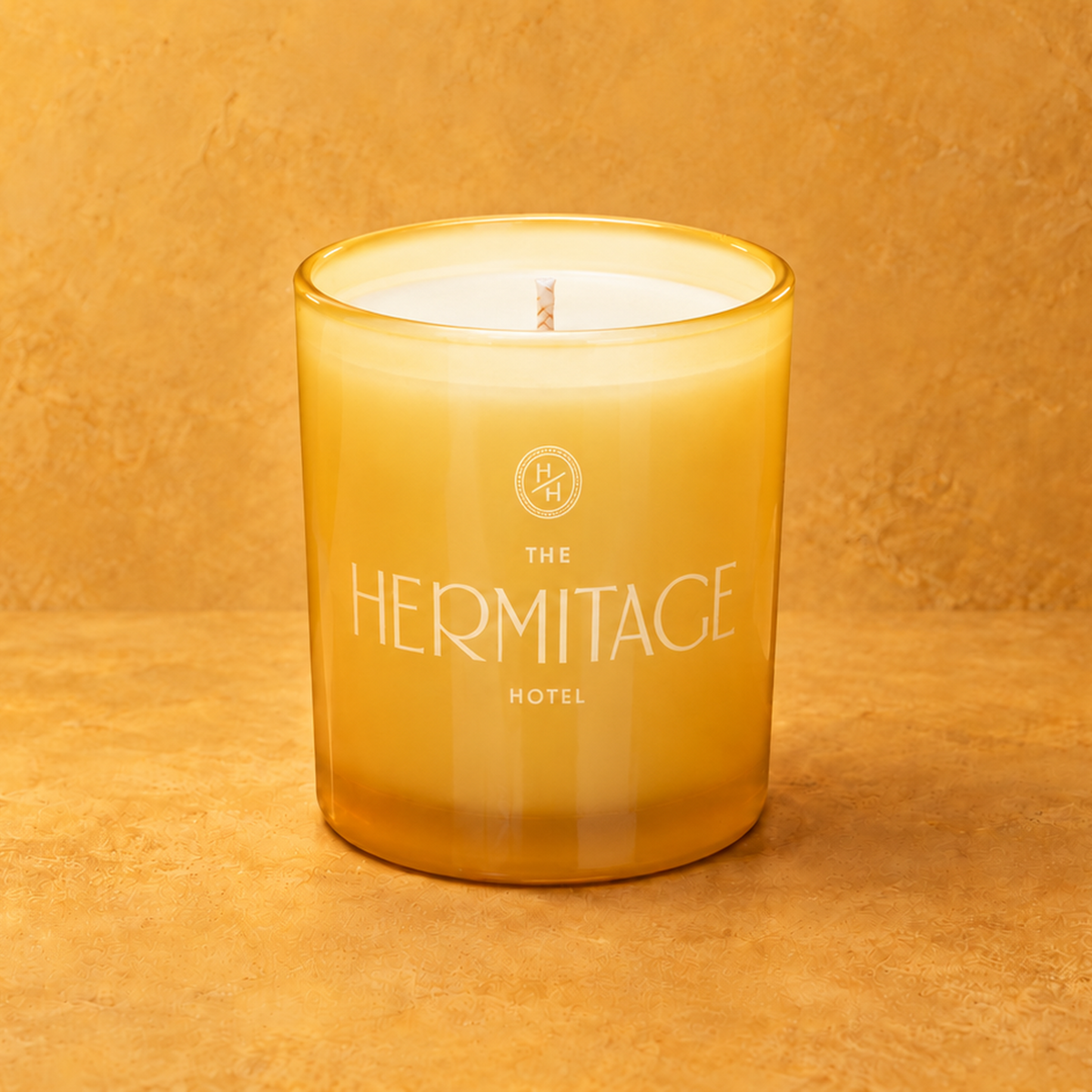 Yellow 9 oz. Classic Engraved Candle with a custom engraved logo, unlit.