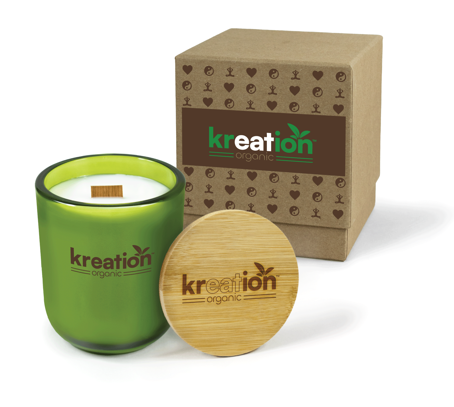 A 12 oz Luxe Custom Candle in the color “Grassland” which is a verdant green from Custom Candles LA. The candle features a wood wick and a brown printed logo for "Kreation Organic" on the front of the glass. Leaning against the side of the candle is a bamboo candle lid etched with the "Kreation Organic" logo. In the background, there is a kraft 2-piece box printed with a pattern of peace signs, hearts, and a person doing yoga, a brown bar and a green and white "Kreation Organic" logo.