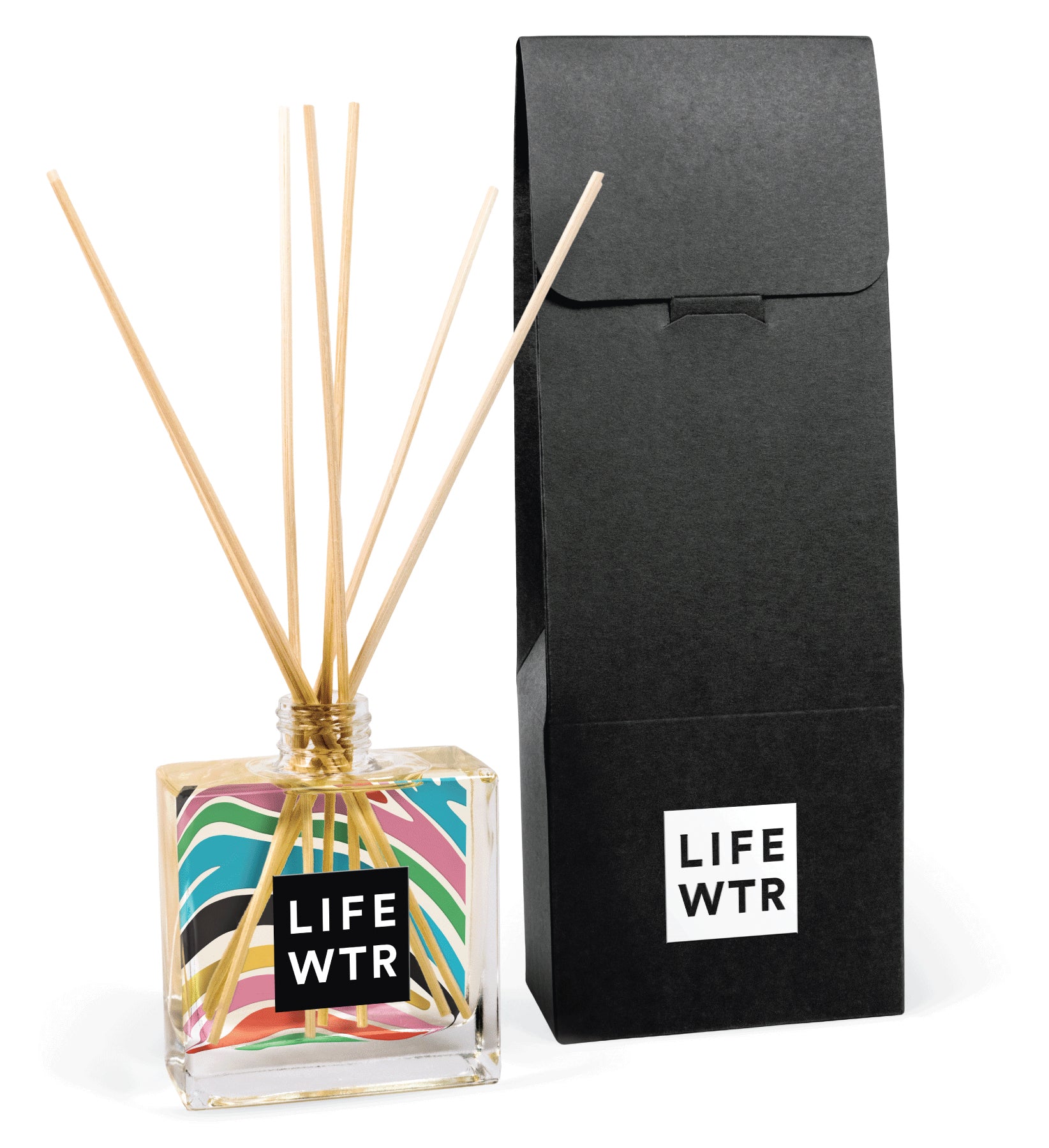 Close-up view of 8 oz clear reed diffuser with branded label design and natural reed sticks inserted in bottle opening