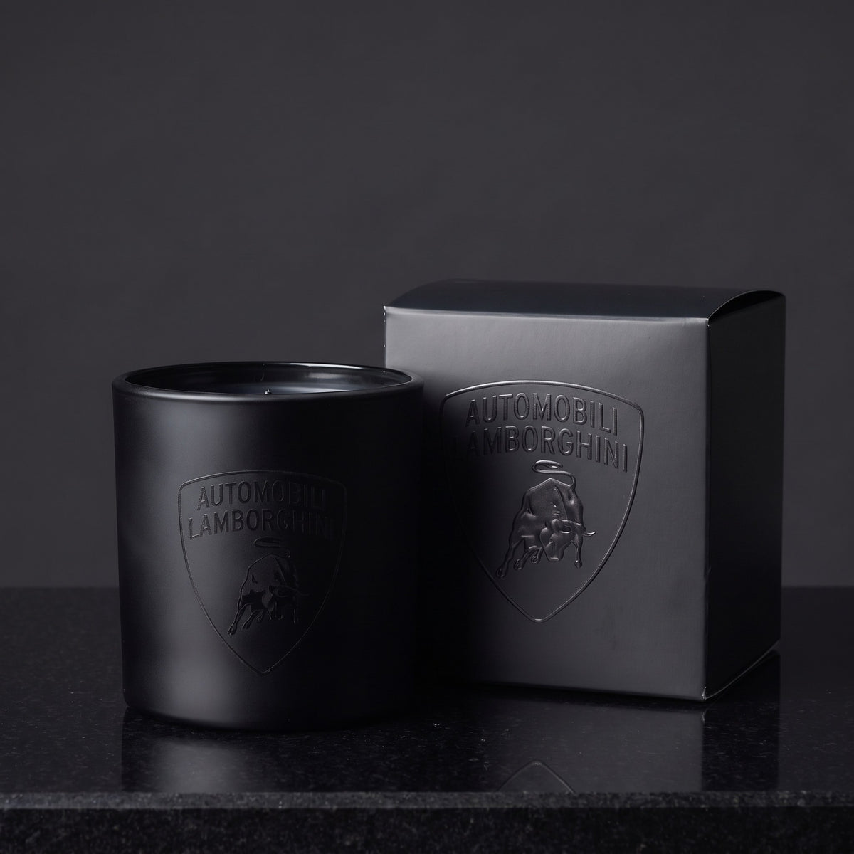 Custom printed 9 oz matte black candle with a tone-on-tone gloss black logo and matching branded gift box, made in Los Angeles by Custom Candles LA