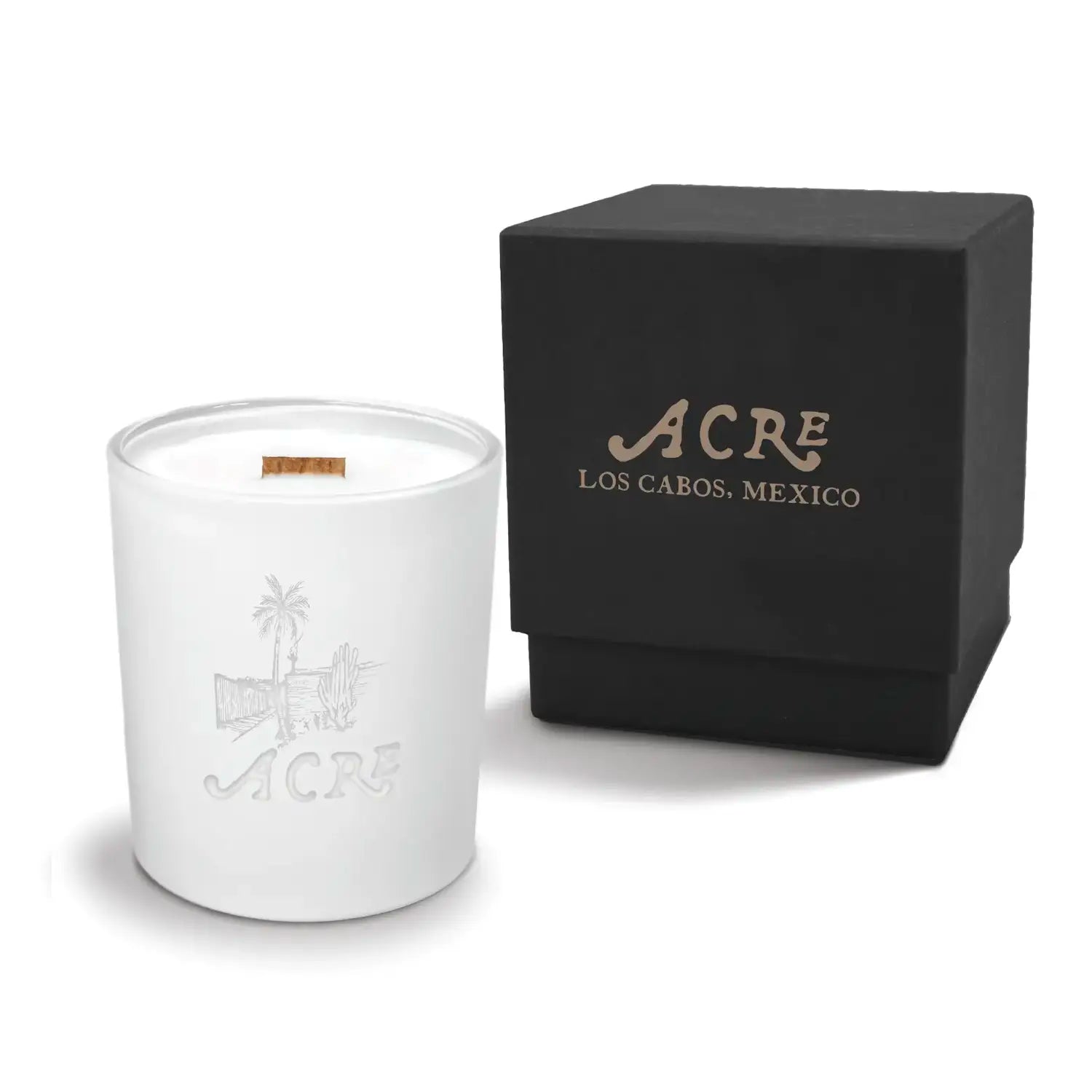 Luxury engraved candle with branding next to a box on a white background