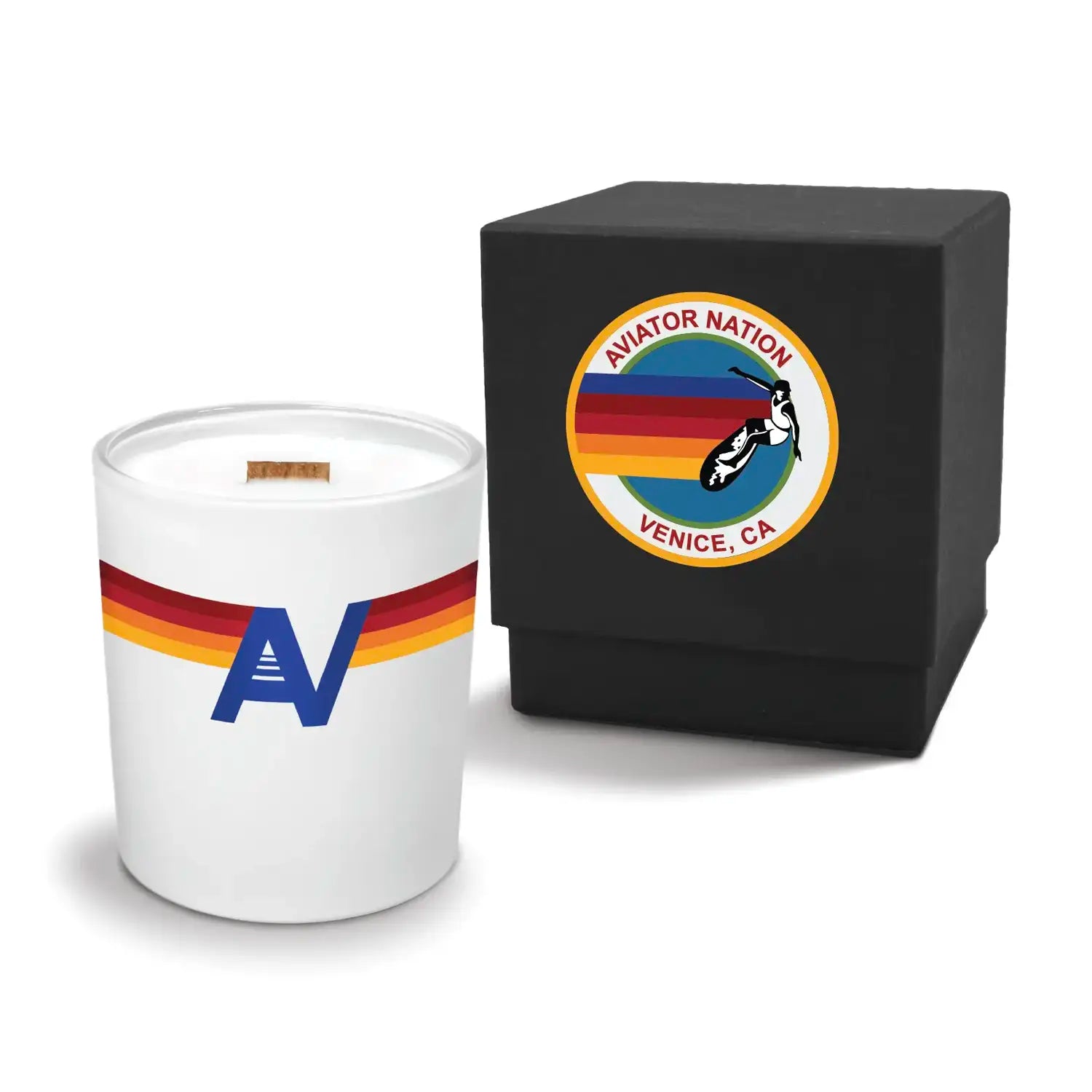 Luxury engraved candle with branding next to a box on a white background