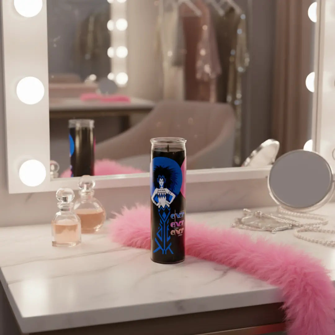 Vanity mirror with lit bulbs, perfume bottles, and a candle on a counter.