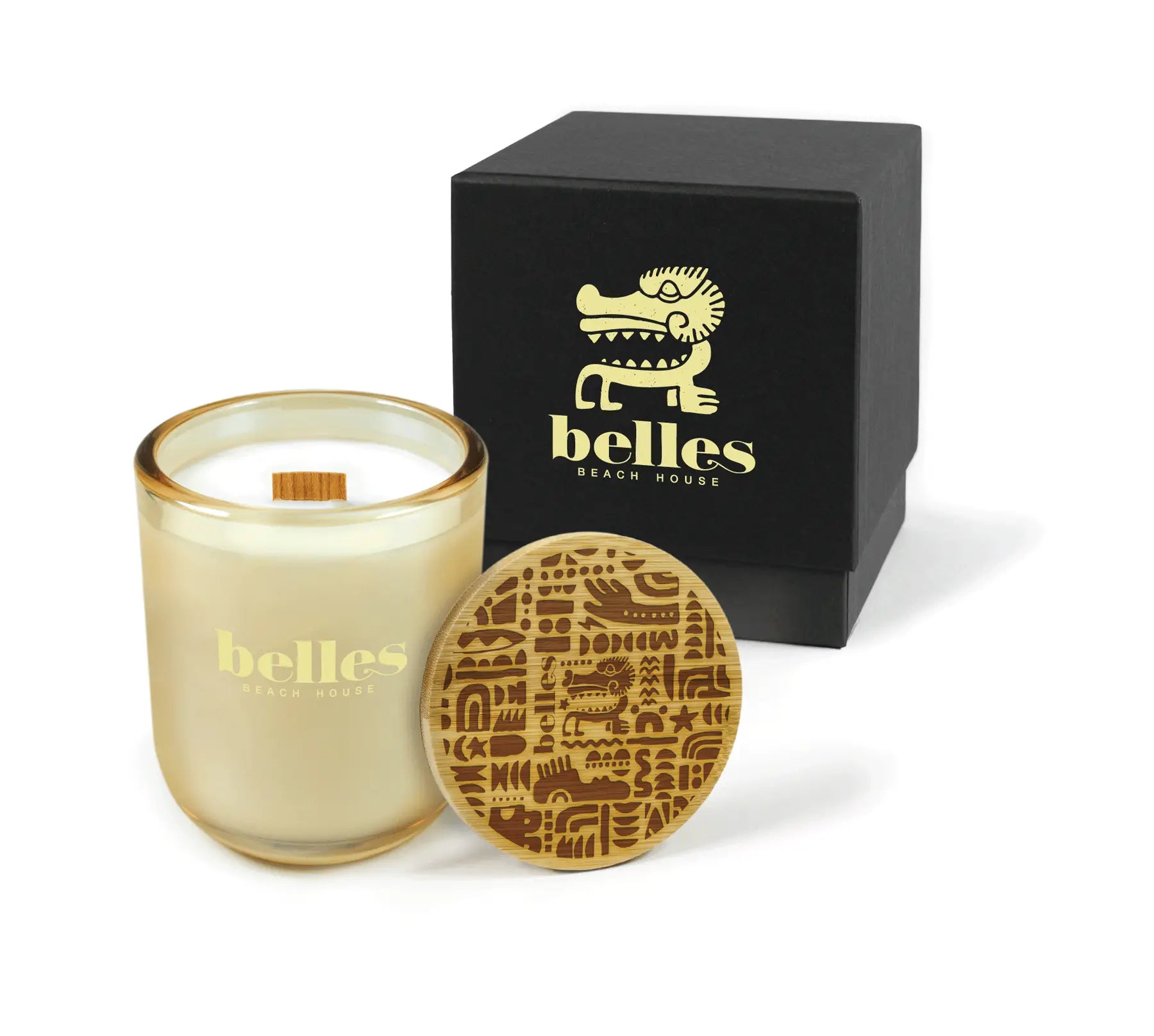 Candle with decorative lid and a branded box on a white background