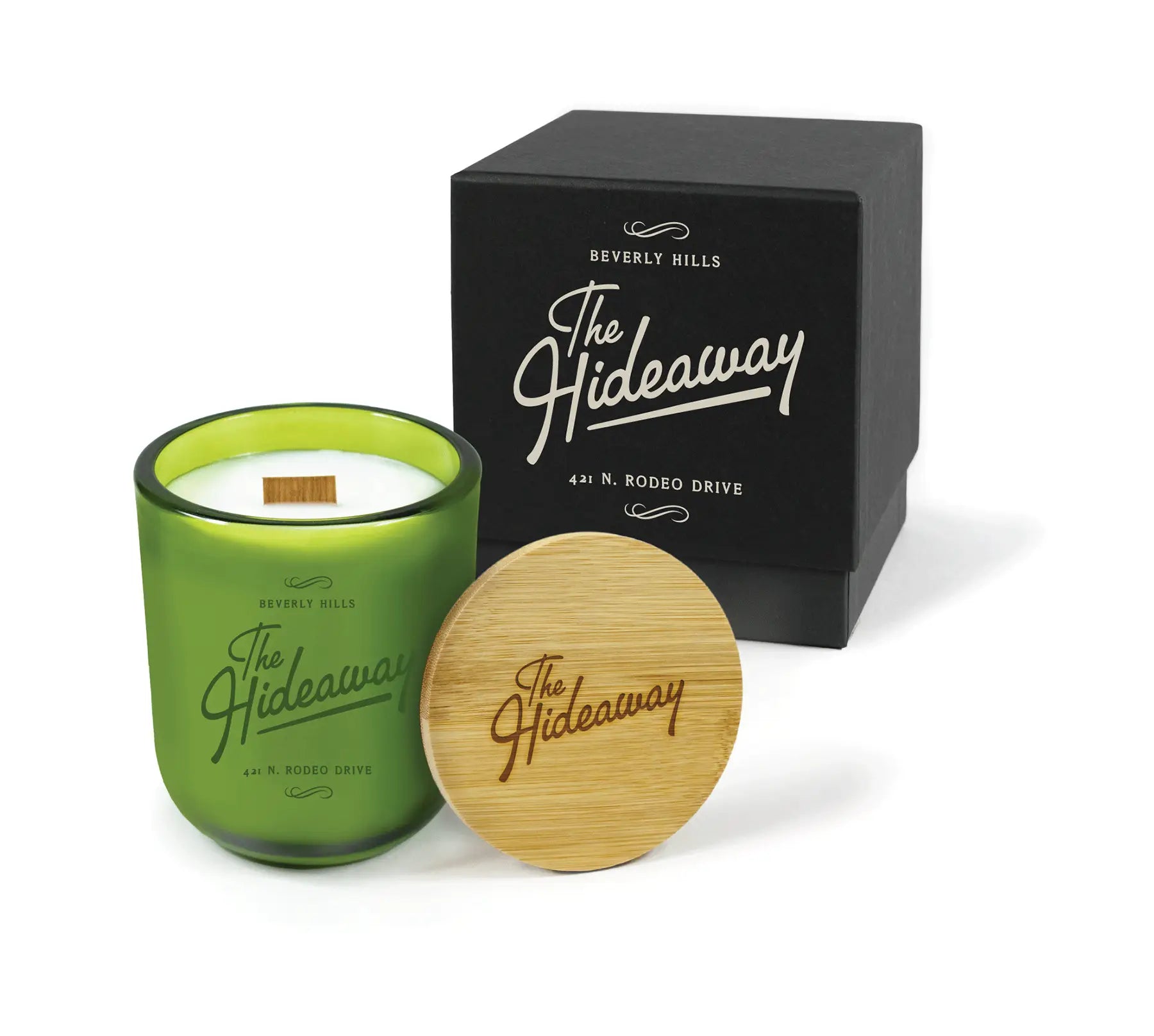 Green candle with wooden lid and black box labeled on a white background