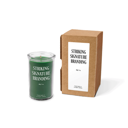 Green wax 5 oz mini prayer candle sample with a printed brand logo and kraft gift box