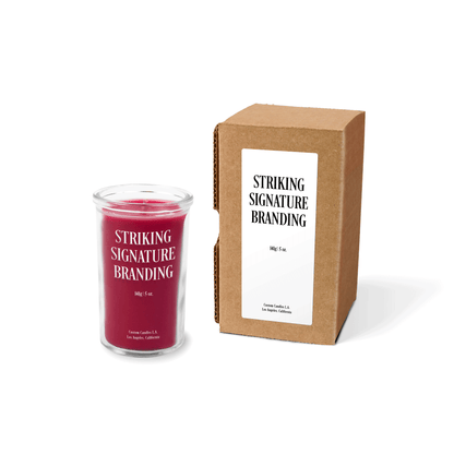Red wax 5 oz mini prayer candle sample with a printed brand logo and kraft gift box