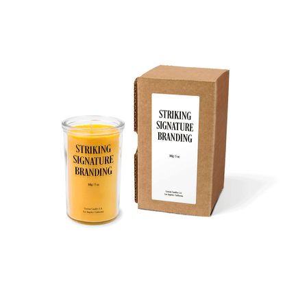 Yellow wax 5 oz mini prayer candle sample with a printed brand logo and kraft gift box