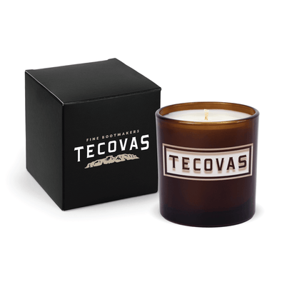 Glossy amber 9 oz. engraved custom candle paired with a matte black gift box.