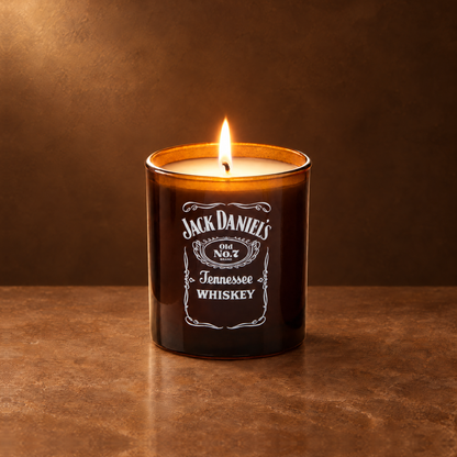 Glossy Amber 9 oz. Classic Printed Candle lit with a printed custom logo, shown on a matching amber background.