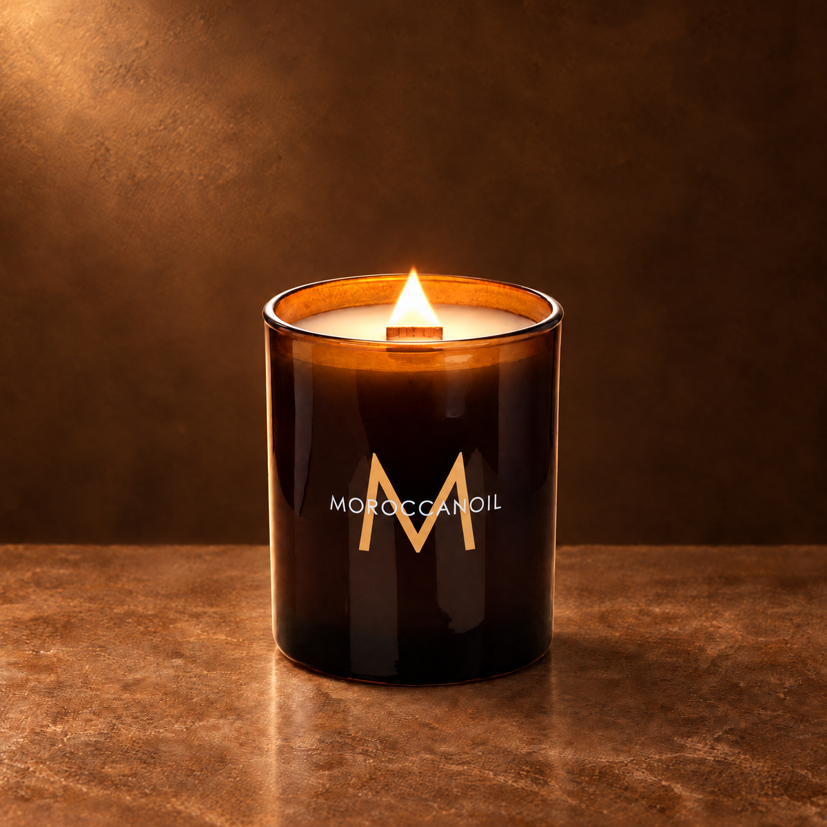 Glossy Amber 14 oz. Luxury Printed Candle lit with a printed custom logo, shown on a matching amber background.