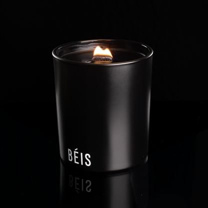 Matte Black 14 oz. Luxury Printed Candle lit, shown on a black background.