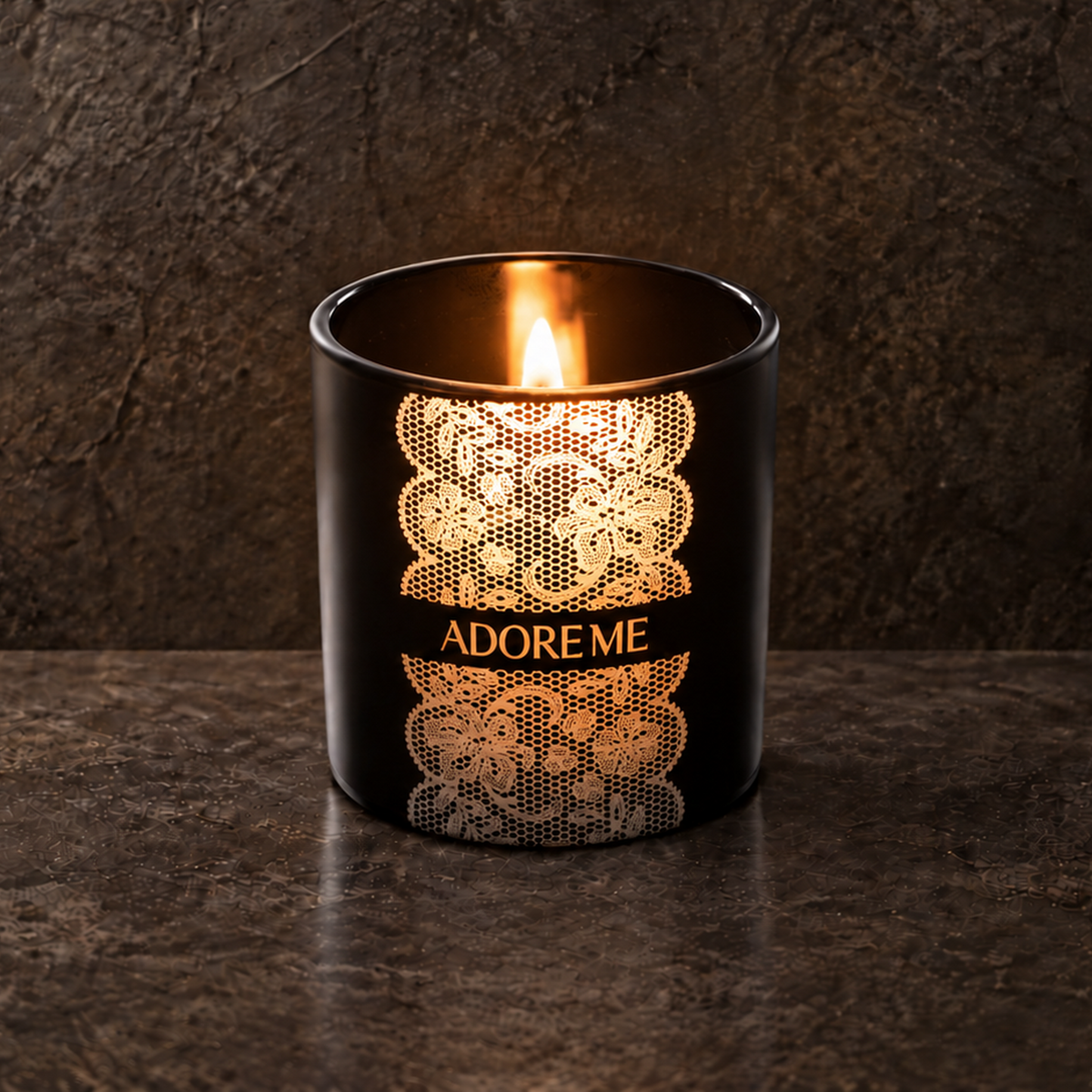 Matte Black 9 oz. Classic Engraved Candle with a custom engraved logo, lit.