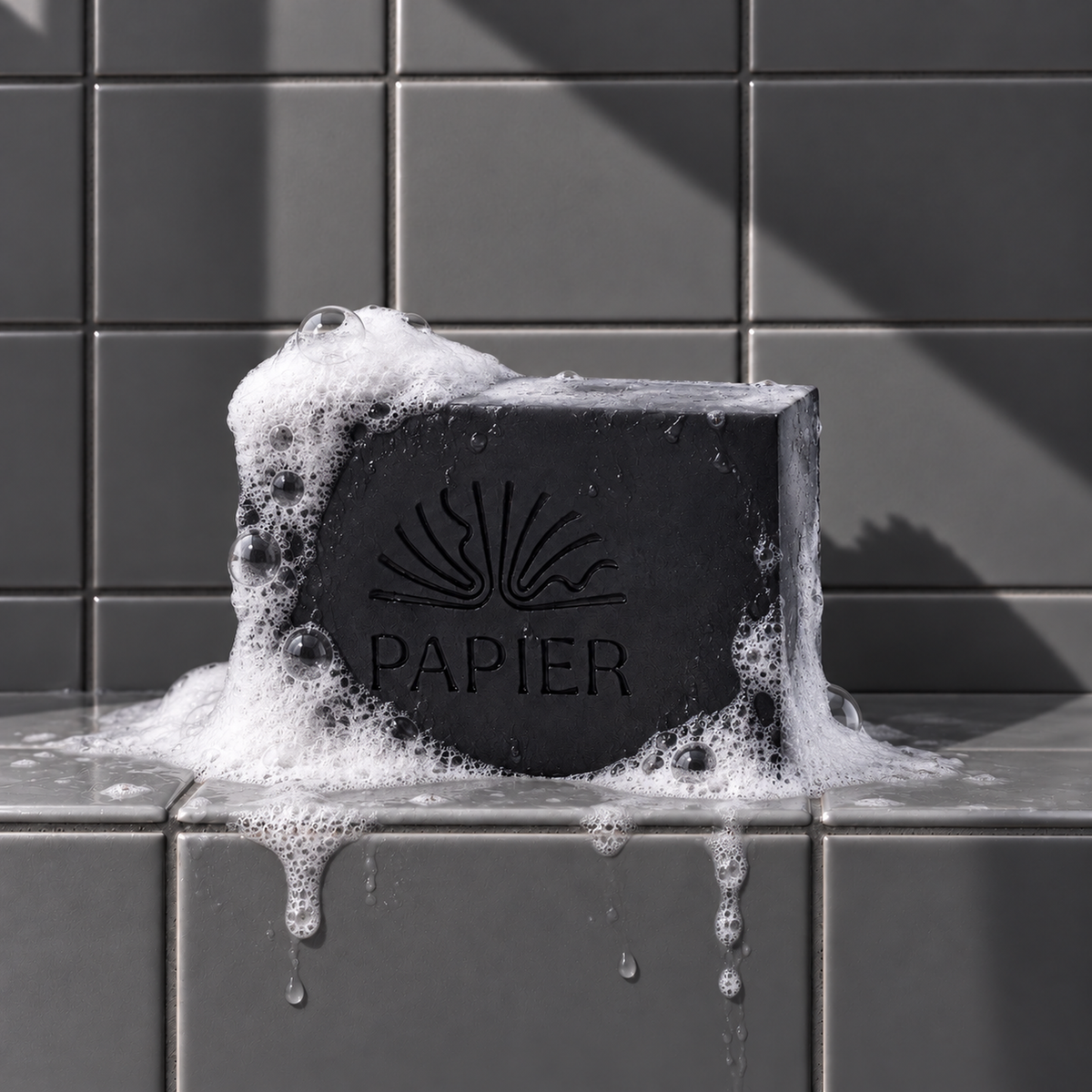 Black rectangle bar soap laser engraved with a brand logo, 3.25 oz, with soap bubbles
