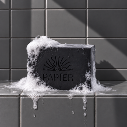 Black rectangle bar soap laser engraved with a brand logo, 3.25 oz, with soap bubbles