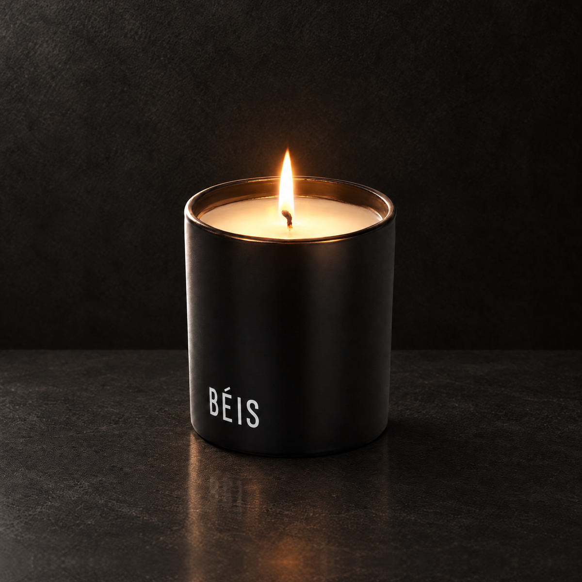 Matte Black 9 oz. Classic Printed Candle lit with a printed custom logo, shown on a matching black background.