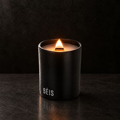 Matte Black 14 oz. Luxury Printed Candle lit with a printed custom logo, shown on a matching black background.
