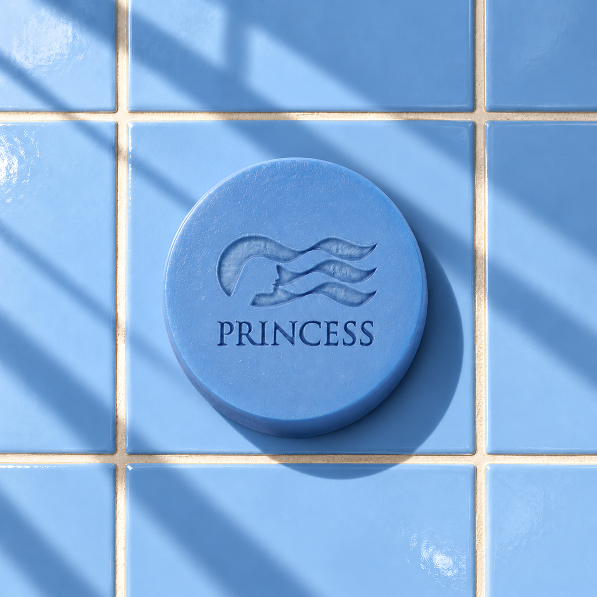 Blue round bar soap laser engraved with a brand logo, 3.6 oz