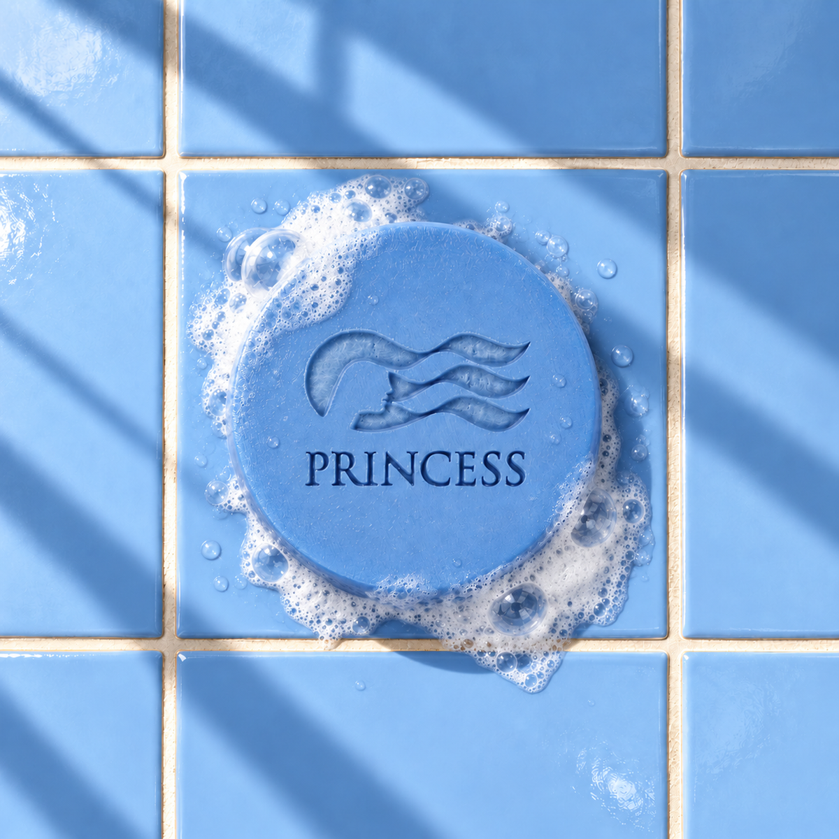 Blue round bar soap laser engraved with a brand logo, 3.6 oz, with soap bubbles