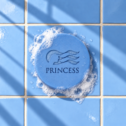 Blue round bar soap laser engraved with a brand logo, 3.6 oz, with soap bubbles