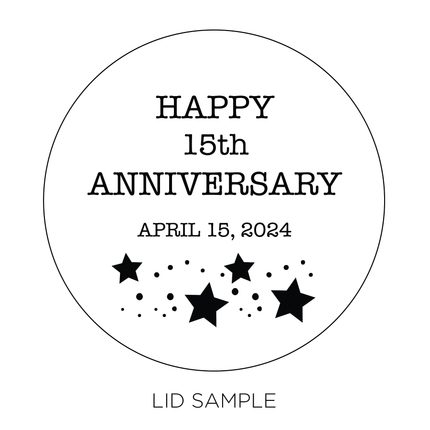 A sample of the wooden lid for the "Moon and Back Candle" by Custom Candles L.A. features the message "Happy 15th Anniversary April 15, 2024 " along with an illustration of stars and dots below—making it the perfect anniversary gift