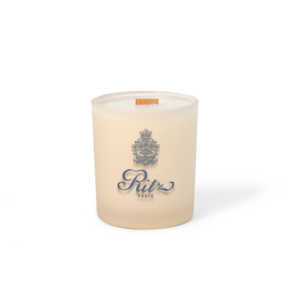 Ivory colored-glass 14 oz candle with a printed brand logo, shown on its own.
