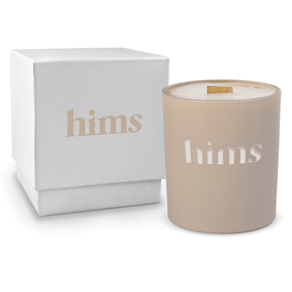 Nude colored-glass 14 oz candle beside a glossy white gift box.