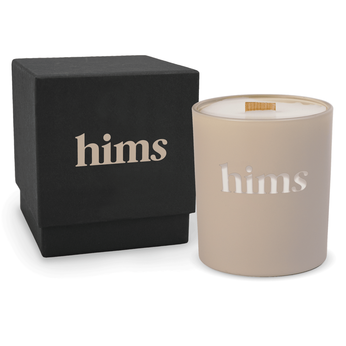 Nude 14 oz colored glass engraved logo candle beside a matte black gift box on a white background.