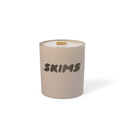 Nude colored-glass 14 oz candle with a printed brand logo, shown on its own.