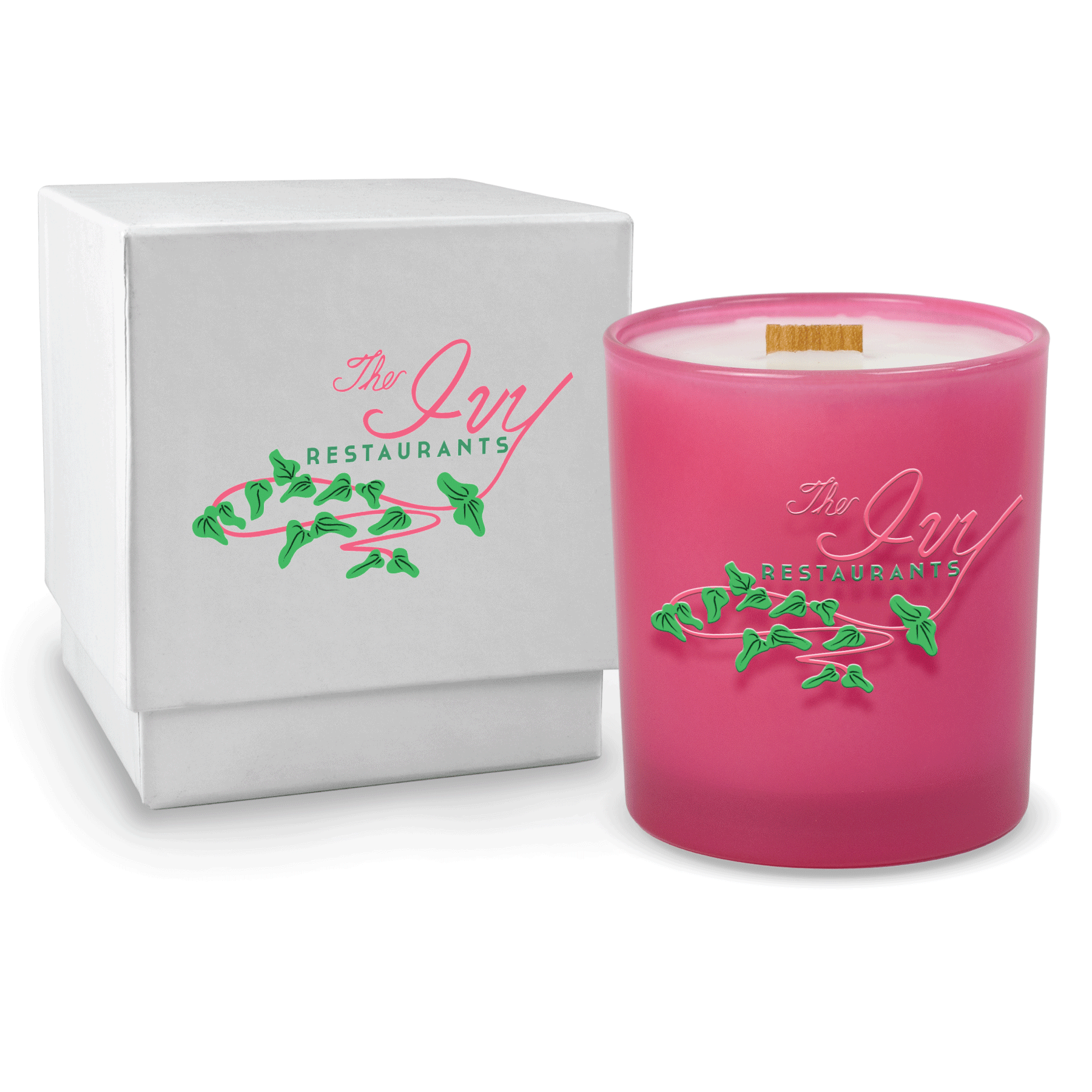 Pink colored-glass 14 oz candle beside a glossy white gift box.