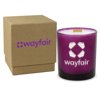 Purple colored-glass 14 oz candle beside a kraft gift box.