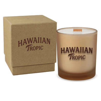 Sand colored-glass 14 oz candle beside a kraft gift box.