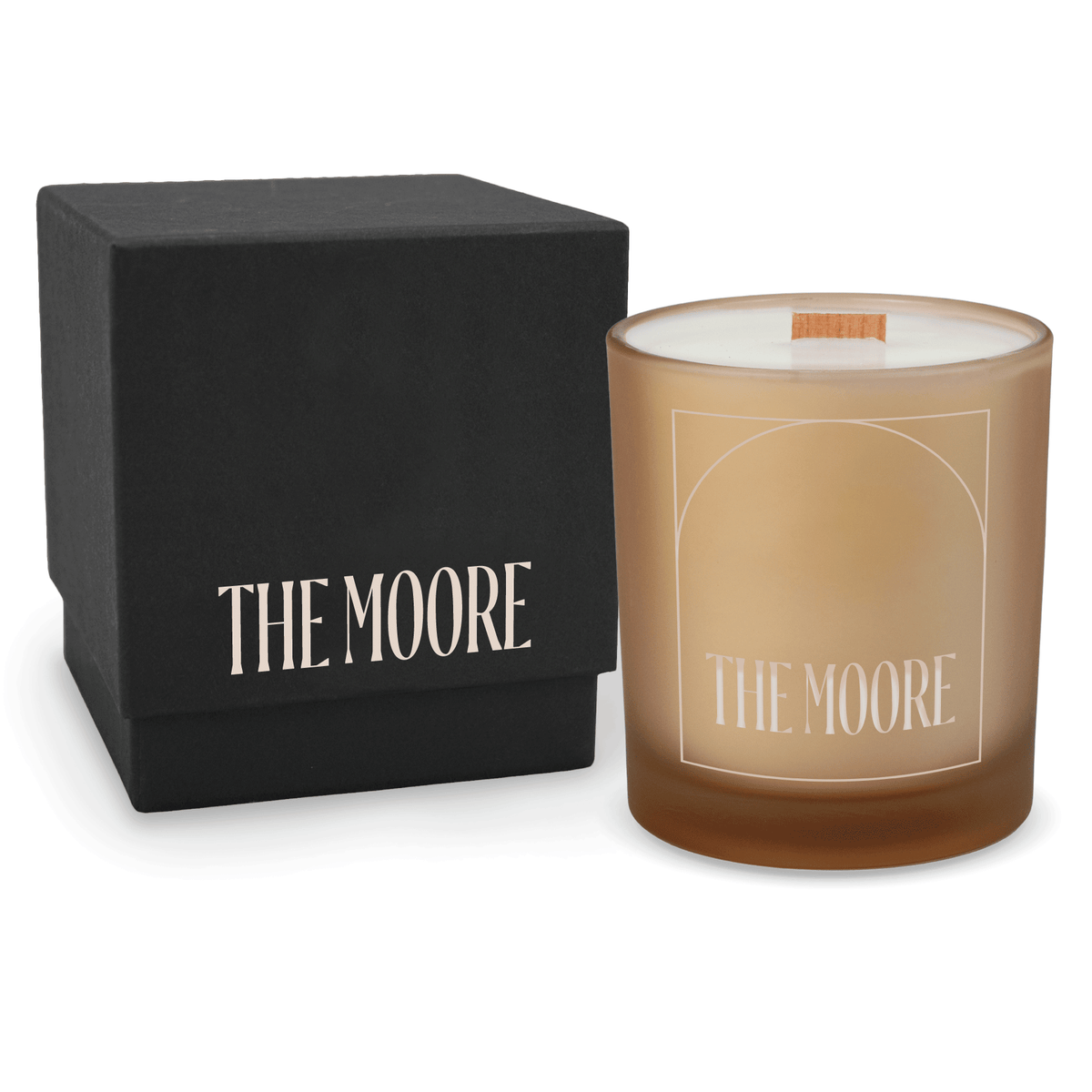 Sand 14 oz colored glass engraved logo candle beside a matte black gift box on a white background.