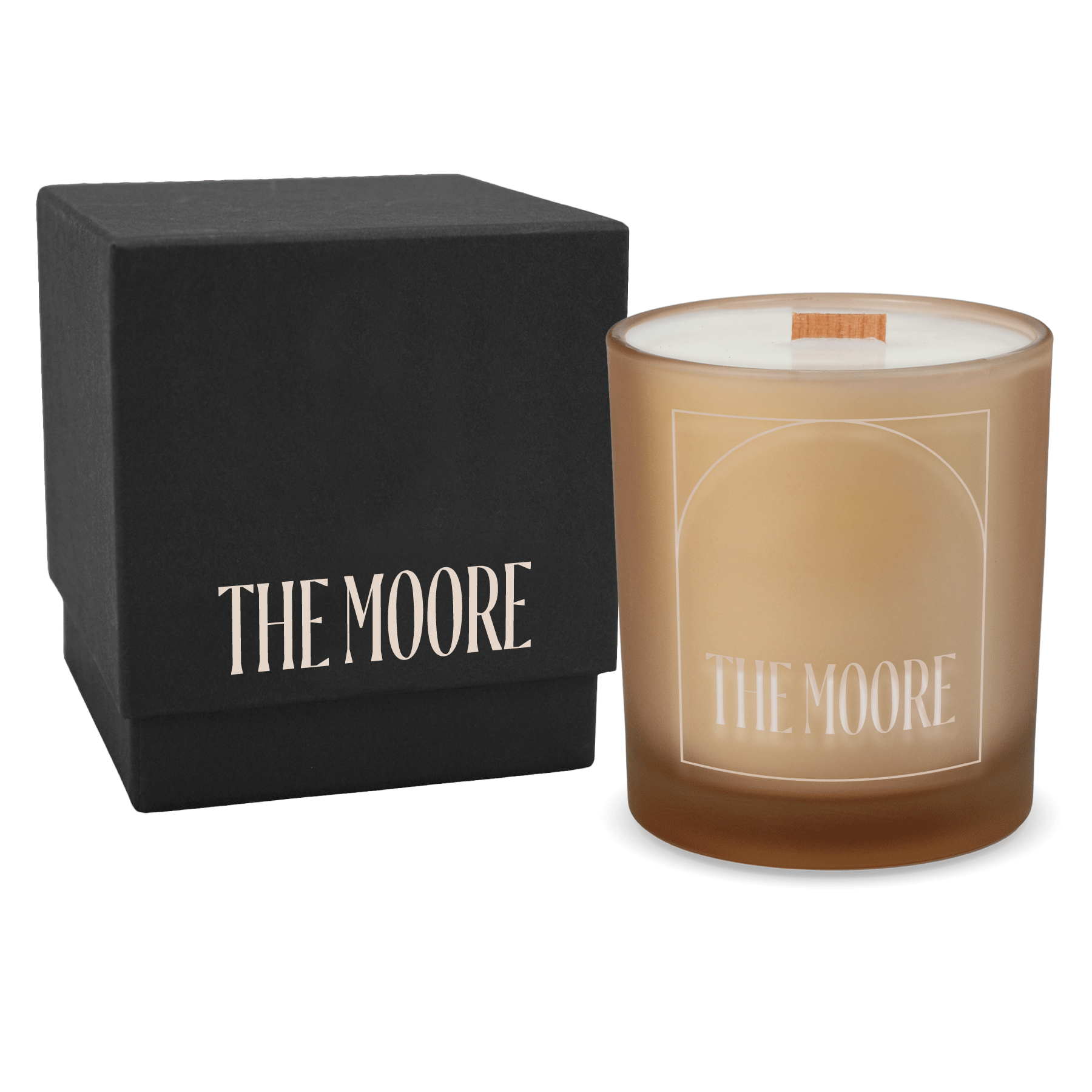 Sand colored-glass 14 oz candle beside a matte black gift box.