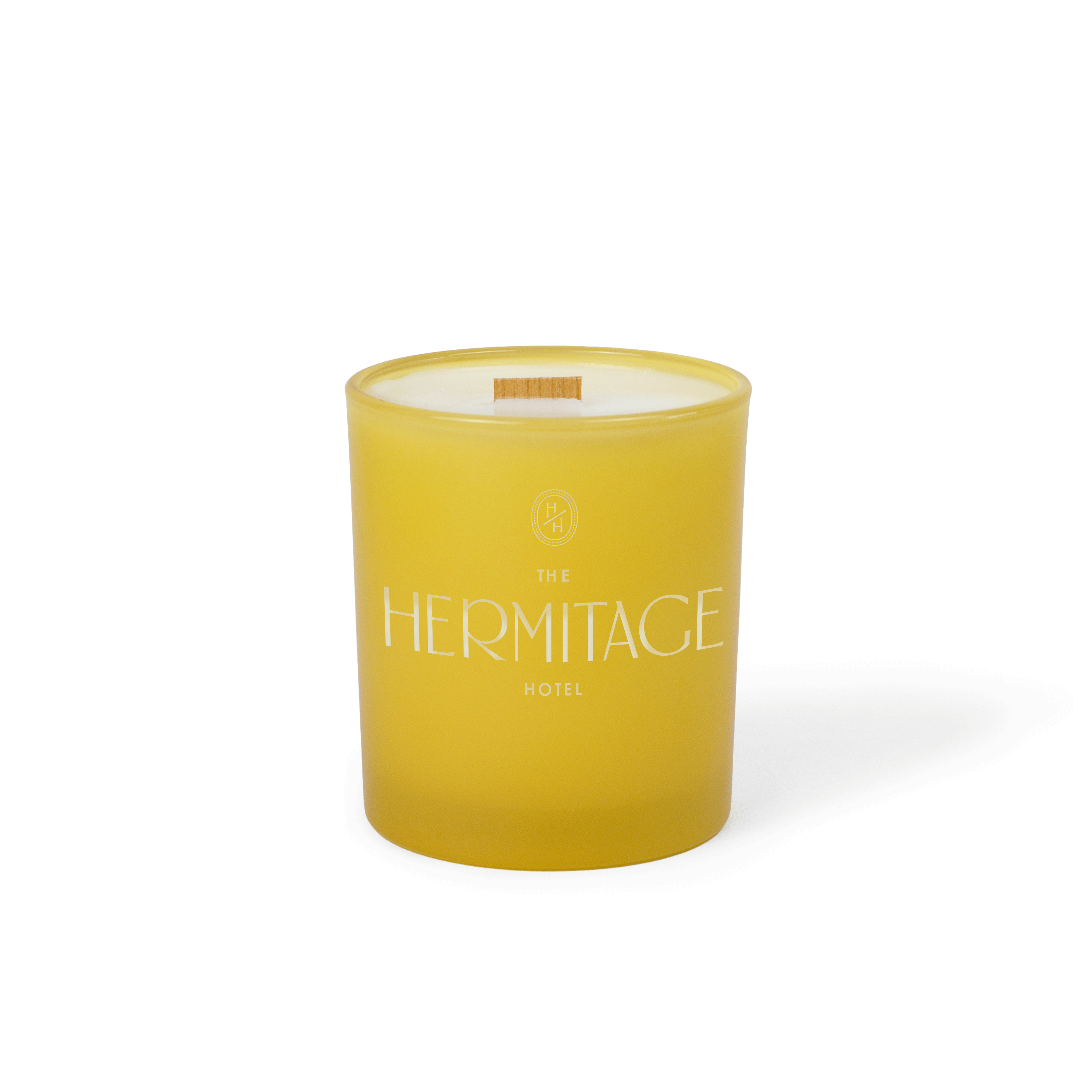 Printed-logo yellow colored glass candle in 14 oz size, photographed on its own